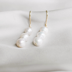 Three pearl earrings