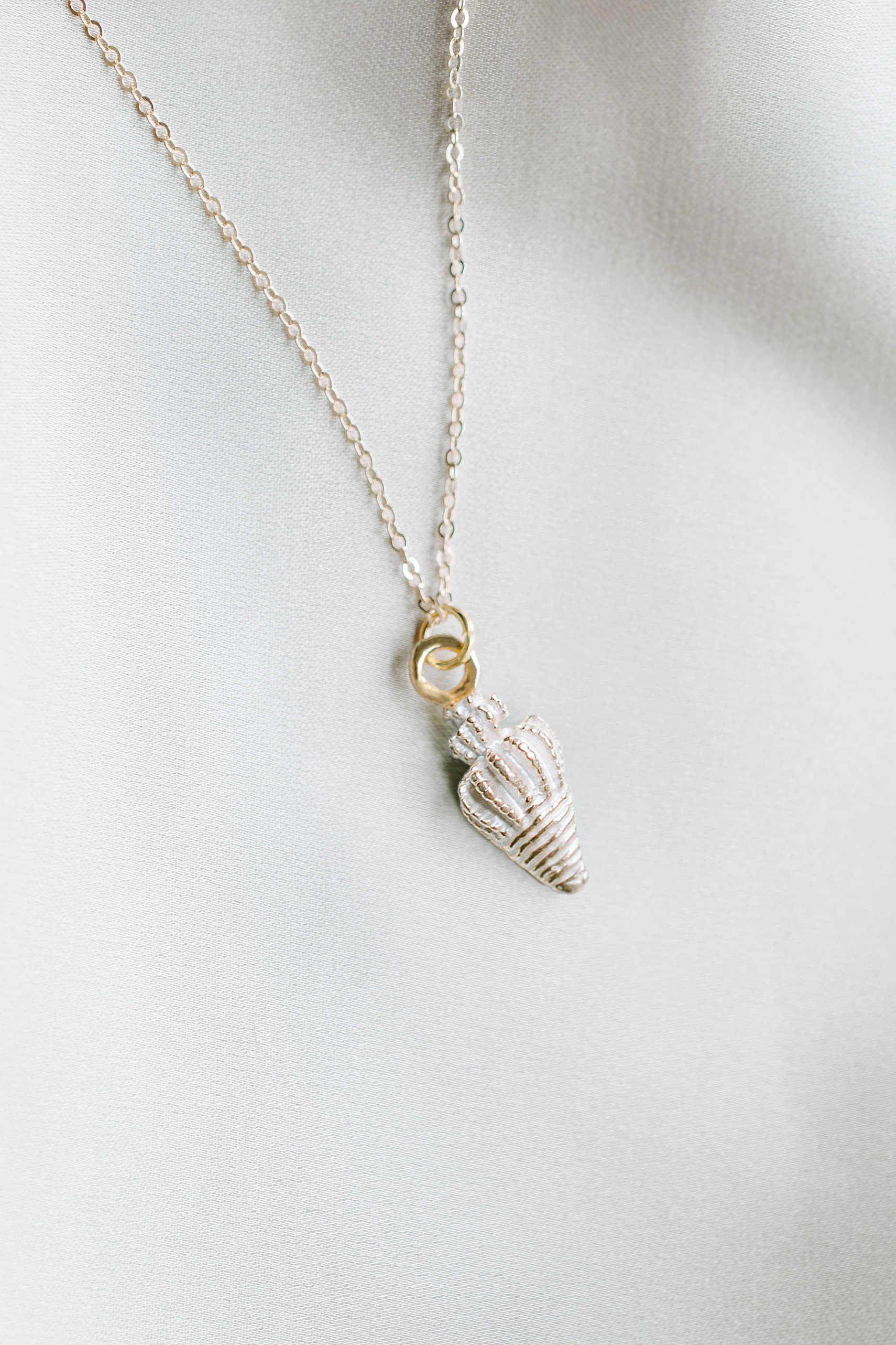 Necklace with white conch shell charm